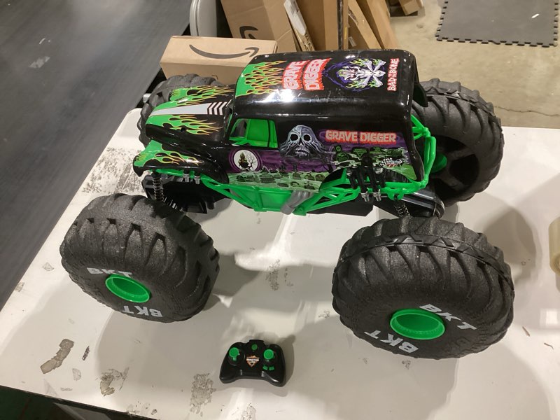 Condition photo showing Good Condition for monster jam, official mega grave digger all-terrain remote control monster truck, over 2 ft. tall, 1:6 scale, kids toys for boys and girls ages 4 and up mega grave digger (untested)