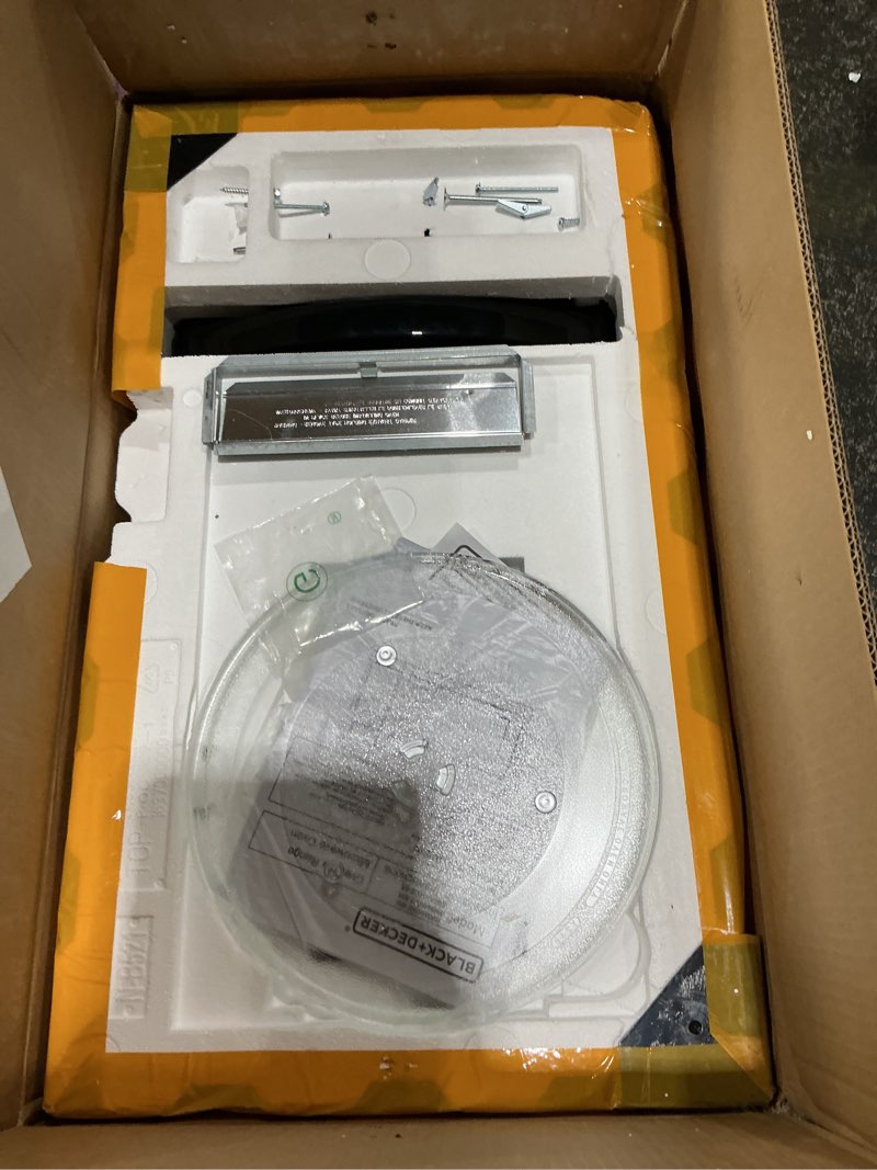 Condition photo showing As Is for black+decker over the range microwave oven with vent and one-touch auto cooking, 1.7 cu. ft. otr over stove microwave, black, 1000 watts, em044k6cf-bk 1.7 cu.ft black