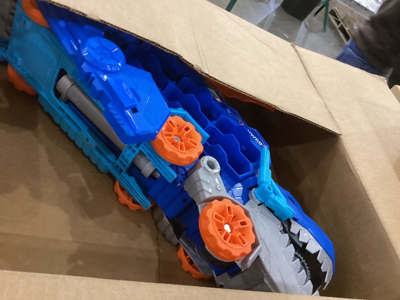Condition photo showing As Is for hot wheels city toy car track set, ultimate t-rex transporter, hauler transforms into stomping dino with race track, from netflix series “let’s race”