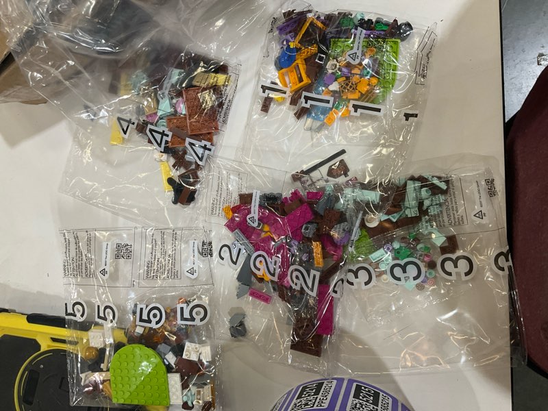 Condition photo showing As Is for X0042COQ53 New - LEGO Dreamzzz 40657 Dream V illage, 434 Pieces, Age 7+