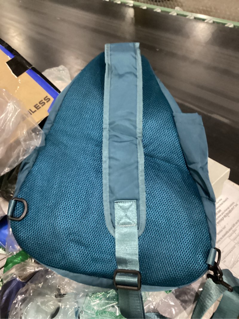 Condition photo showing Good Condition for dark green one strap backpack 