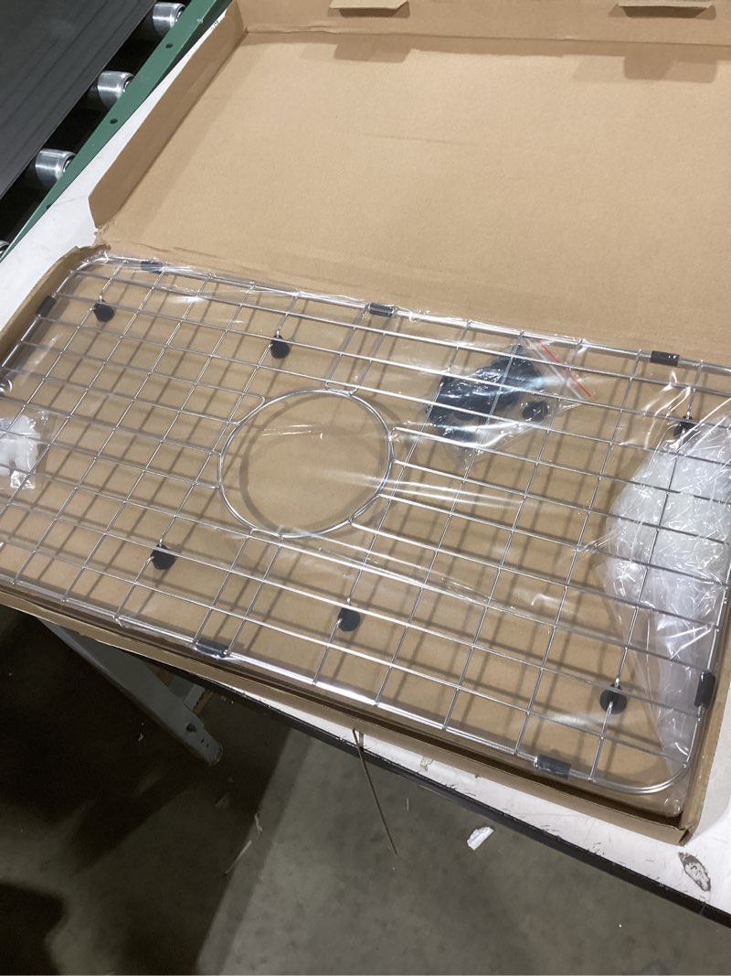 Condition photo showing New/Like New for Serene Valley Sink Bottom Grid 24-1/8" x 12-5/8", Centered Drain with Corner Radius 1-1/2", Sink Protector NLW2412C