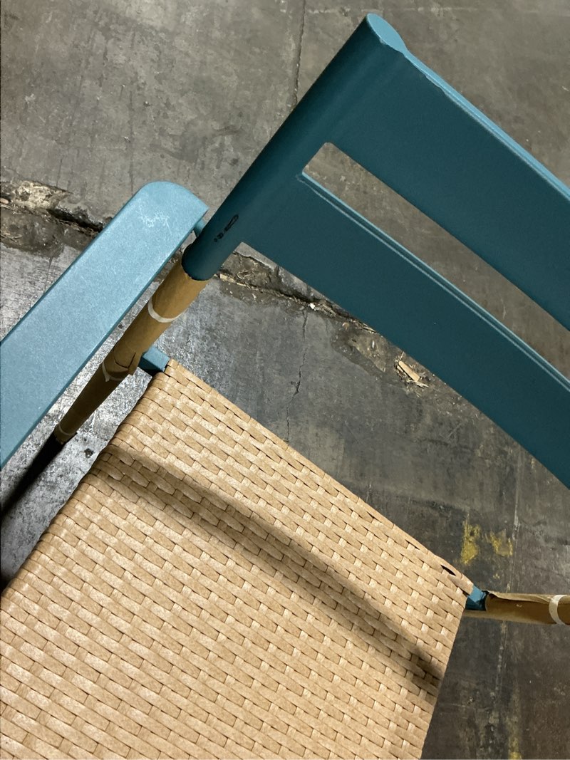 Condition photo showing As Is for wicker stackable teal steel frame stationary dining chair with woven seat