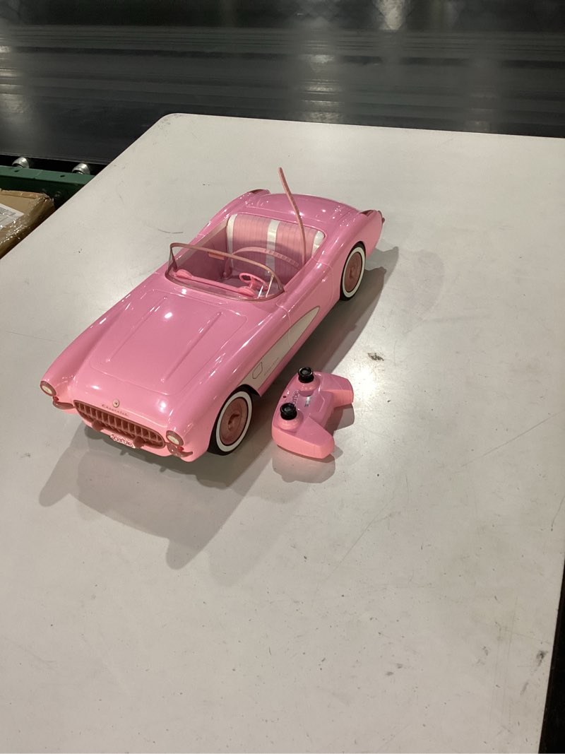 Condition photo showing As Is for barbie the movie collectible car, pink corvette convertible