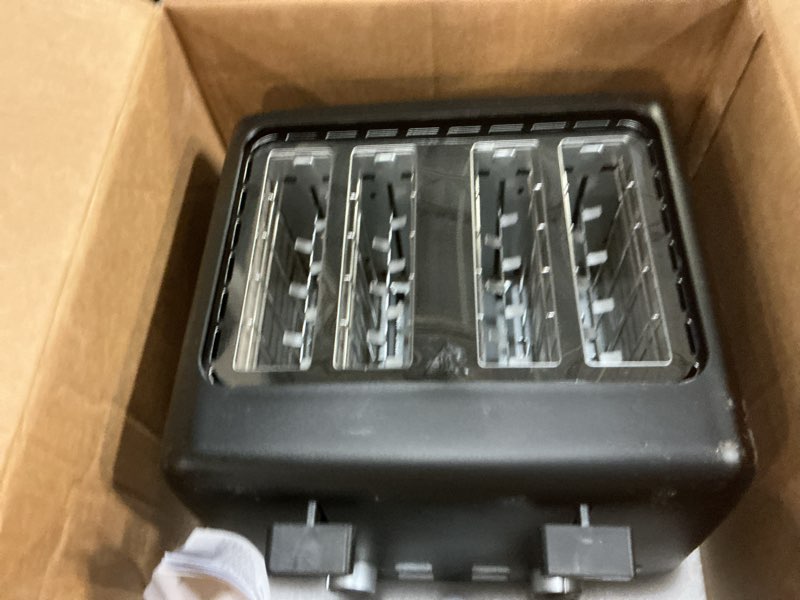 Condition photo showing New/Like New for Amazon Basics 4 Slice Toaster, With 7 Browning Settings, Extra Wide Slots For Bagels and Special Breads, Removable Easy-to-Clean Crumb Trays, Cancel/Defrost/Bagel Buttons, 1500W, Black & Silver