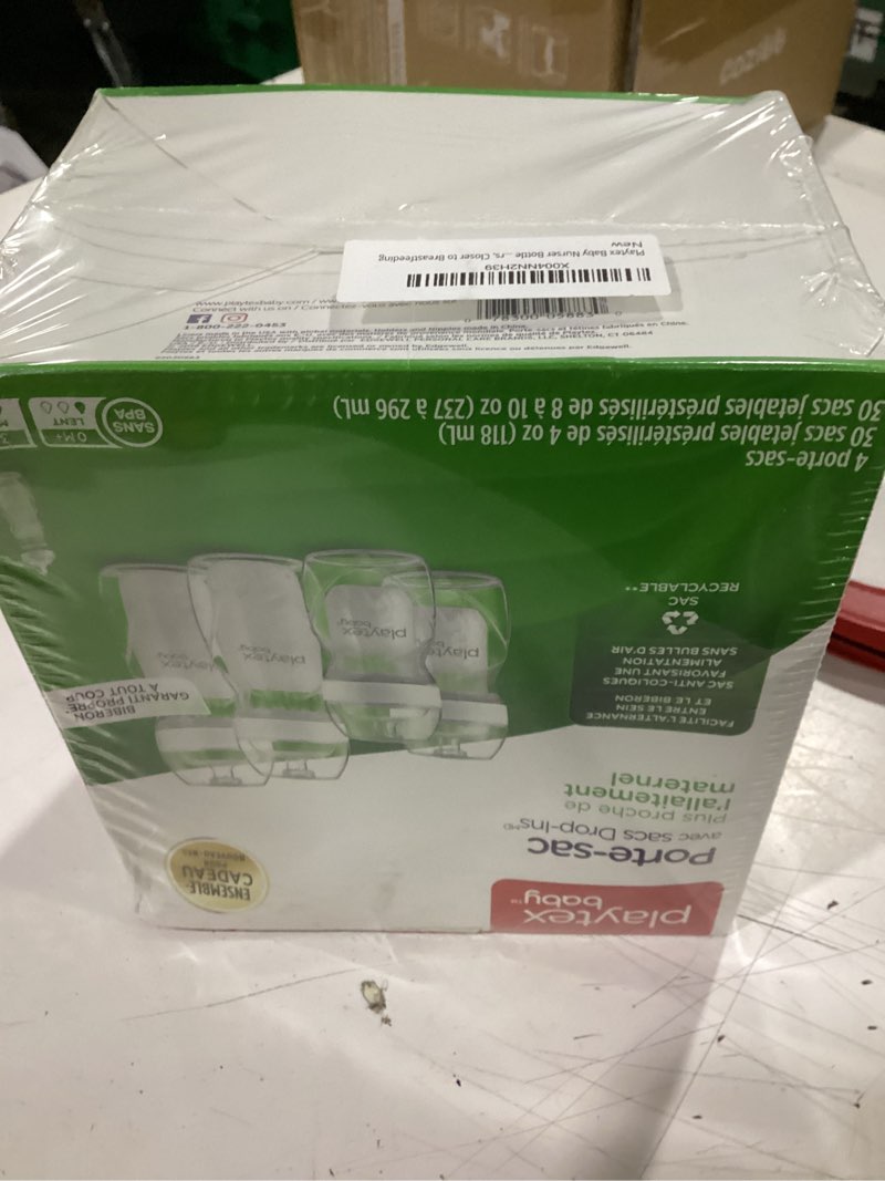 Condition photo showing New/Like New for playtex baby nurser bottle gift set, with pre-sterilized disposable drop-ins liners, closer to breastfeeding