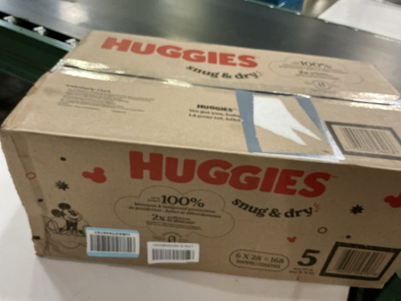 Condition photo showing New/Like New for huggies size 5 diapers, snug & dry baby diapers, size 5 (27+ lbs), 168 count (6 packs of 28), packaging may vary size 5 168