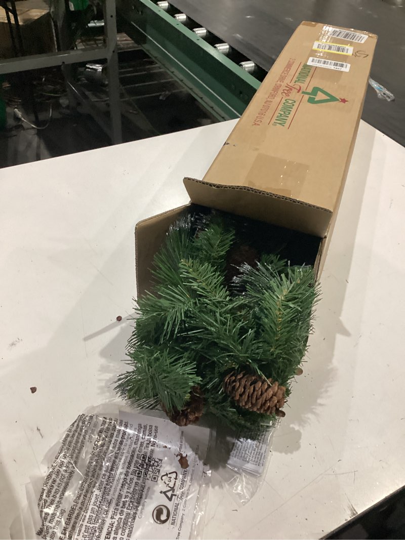 Condition photo showing Good Condition for national tree company 9 ft pre-lit crestwood spruce artificial christmas garland, christmas decoration with glitter, pinecones, red berries, 50 clear lights, 180 tips, green plug in tree