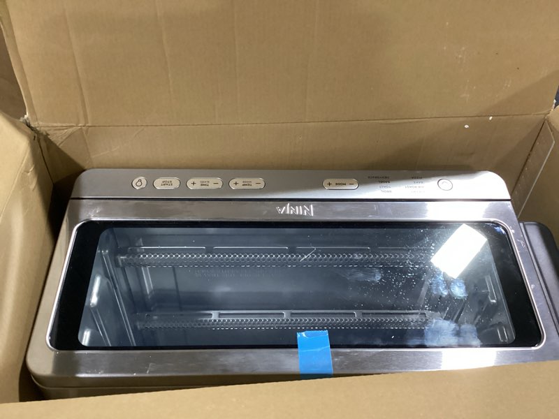Condition photo showing As Is for Ninja Air Fryer Toaster Oven Combo | 8-in-1 Functionality | Flip Up & Away for Storage Space | Air Fry Basket, Sheet Pan, Wire Rack & Removable Crumb Tray |1800 Watt | Stainless Steel | SP151 Stainless Premium 8-in-1 Flip Oven