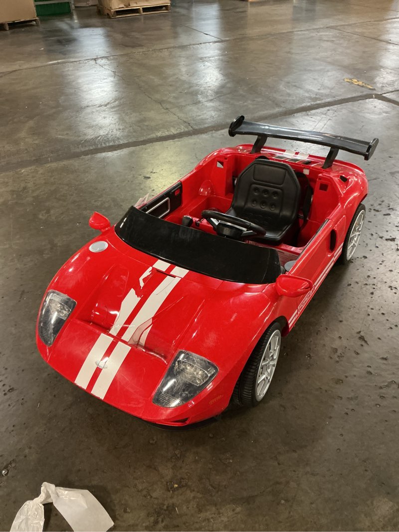 Condition photo showing As Is for xuanlur 12v licensed ford gt kids ride on toy, 12v battery powered electric car w/remote control, 4-wheel suspension, 3 speed, battery display, led lights, ride on car for toddler 1-5 years, red