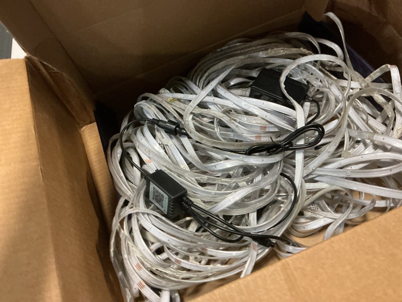 Condition photo showing As Is for 200ft Outdoor LED Strip Lights Waterproof,IP68 Waterproof LED Light Strips with Remote,App Control Music Sync RGB Outdoor LED Rope Lights,LED Lights for Bedroom,Roof,Pool,Deck,Balcony
