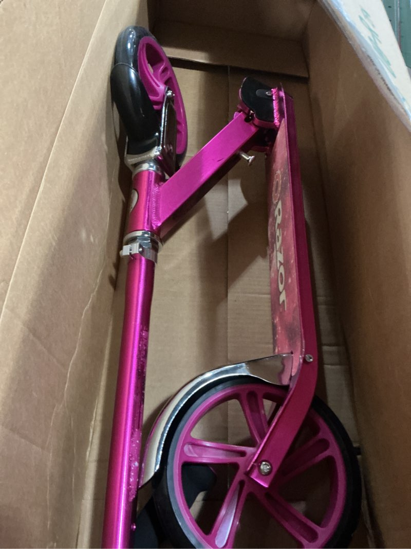 Condition photo showing As Is for razor a5 lux kick scooter for kids ages 8+ - 8" urethane wheels, anodized finish featuring bold colors and graphics, for riders up to 220 lbs pink scooter