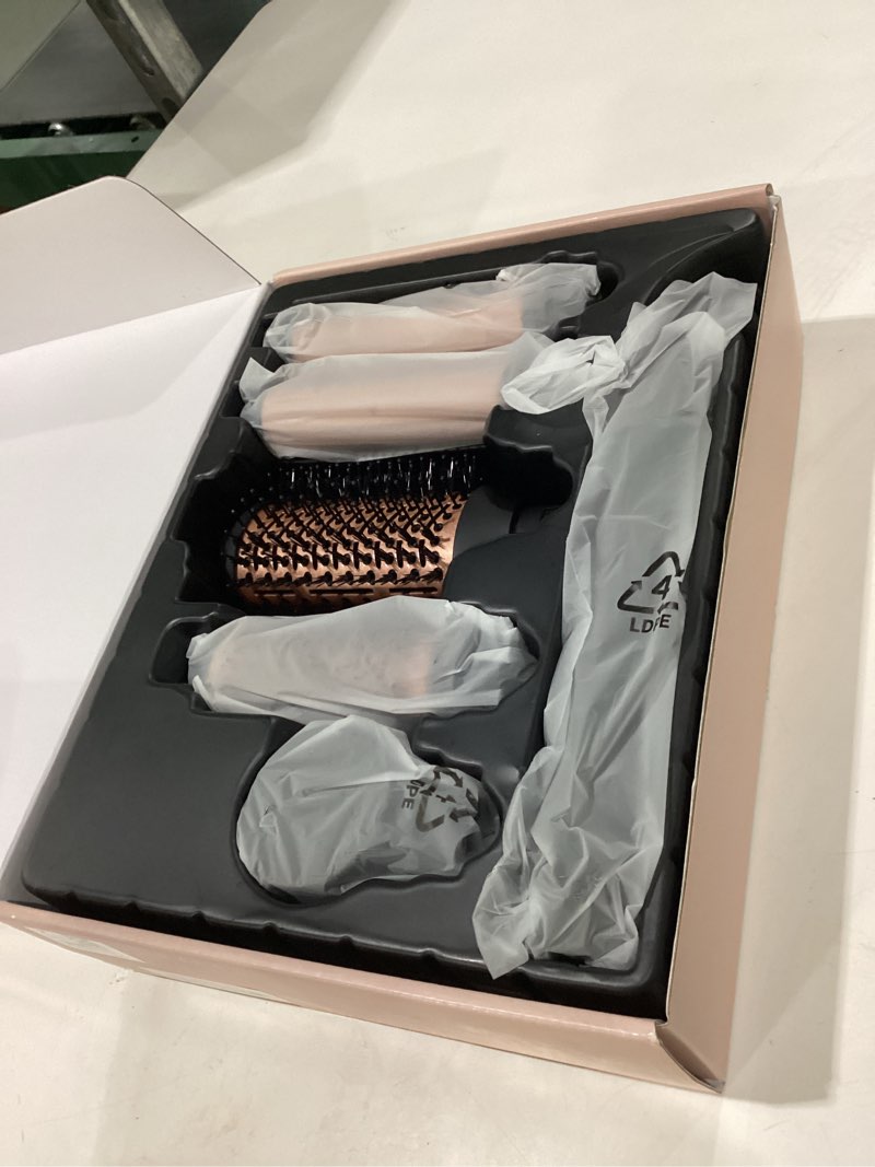 Condition photo showing New/Like New for 5-in-1 hot air styler wrap, high-speed hair dryer brush blow dryer with 2 auto wrap curlers for curling, straightening, volumizing, fast drying & frizz-free styling for all hair types