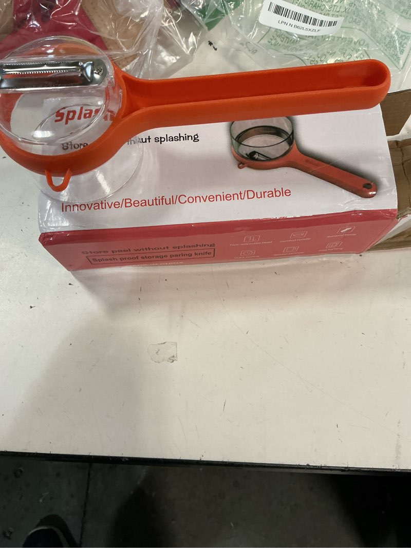 Condition photo showing As Is for premium kitchen peeler with ergonomic handle, dual-sided stainless steel blade, orange (missing lid)