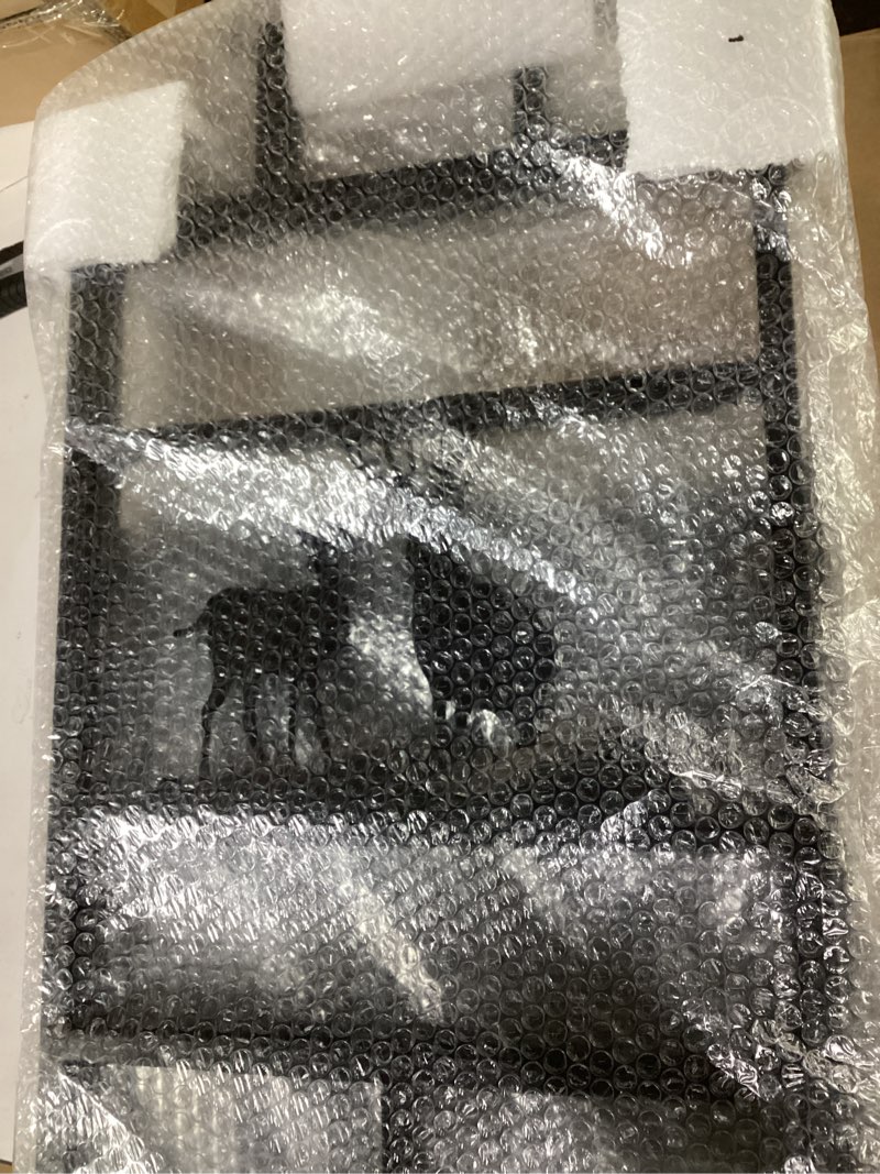 Deer cut out into metal fence 