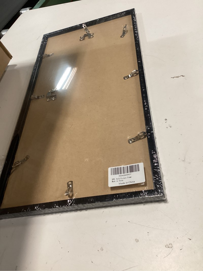 Condition photo showing Good Condition for MENNTHUI 9x19 Black Picture Frame, Wall Mounting Horizontally or Vertically, Decoration for Photos, Paintings, Posters, Artwork