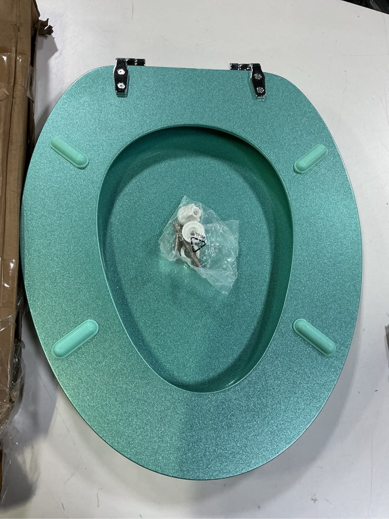 Condition photo showing Good Condition for BLOFDE Elongated Toilet Seat Wood Toilet Seat Prevent Shifting with Zinc Alloy Hinges American Standard Size Toilet Seat Easy to Install also Easy to Clean(Elongated,Sparkling Turquoise) Elongated Turquoise