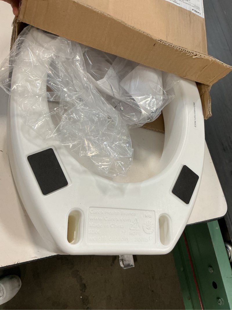 Condition photo showing As Is for carex toilet seat riser  elongated raised toilet seat adds 3.5 inches to toilet height  for assistance bending or sitting  300 pound weight capacity toilet riser