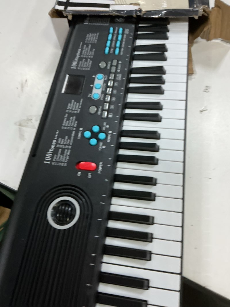 Condition photo showing New/Like New for 61 key keyboard piano, portable electronic digital piano, built in dual speakers, external microphone, power plug, rich teaching content, multi-functional electronic piano suitable for beginners