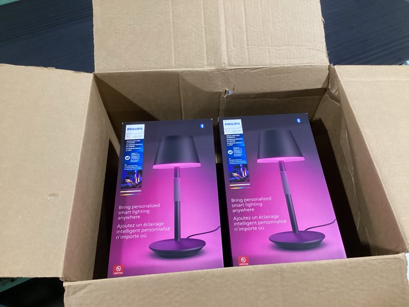 Condition photo showing New/Like New for philips hue go smart portable table lamp, black - white and color ambiance led color-changing light - 2 pack - indoor and outdoor use - control with hue app or voice assistant