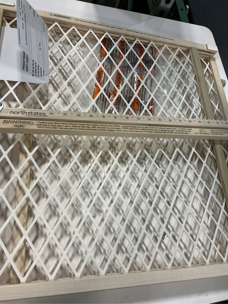 Condition photo showing As Is for summer infant secure pressure mount wood & plastic baby gate, natural hardwood finish – 24” tall, fits openings up to 27.5” to 42” wide, baby and pet gate for doorways natural wood