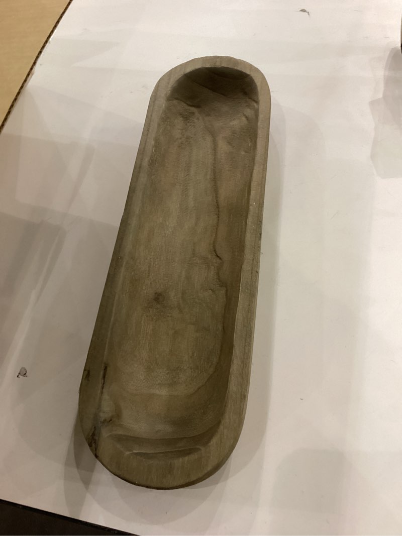 This is a hand-carved wooden dough bowl.  