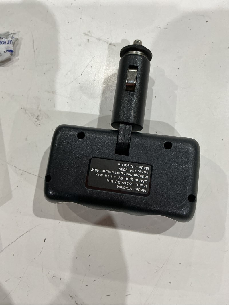 Condition photo showing As Is for auto drive dual 12v/24v adapter with two usb charging ports  compatible with smartphones and tablets