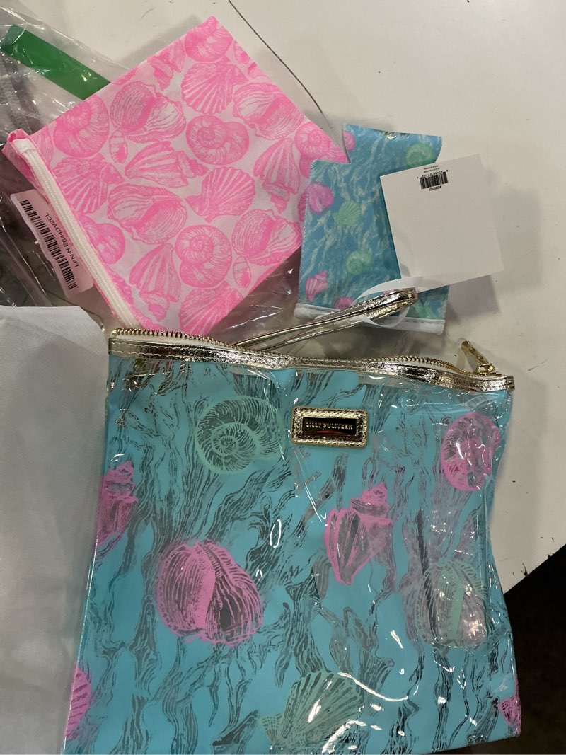 Condition photo showing Good Condition for lilly pulitzer water resistant vinyl beach day pouch, zipper bag includes drink hugger, small pouch, and towel clips shelden