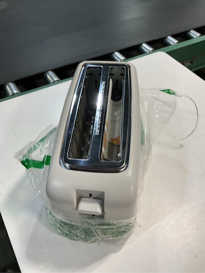 Condition photo showing As Is for bella 4 slice slim toaster, fits-anywhere™ kitchenware, 6 setting shade control with reheat & cancel buttons, fits sourdough, 10” long slot, anti jam & auto shutoff, 900 watt, oatmilk 4 slice oatmilk