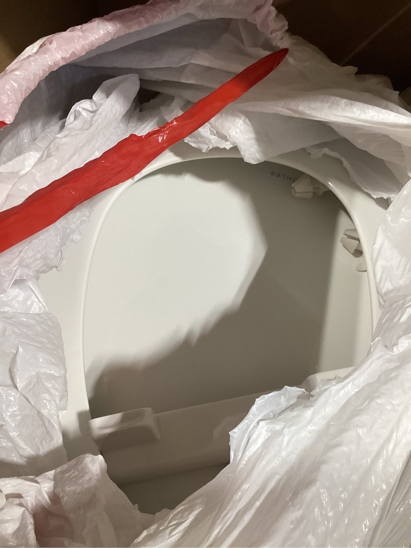 Condition photo showing As Is for kohler k-20110-0 brevia elongated toilet seat with grip-tight bumpers, quiet-close seat, quick-attach hardware, white