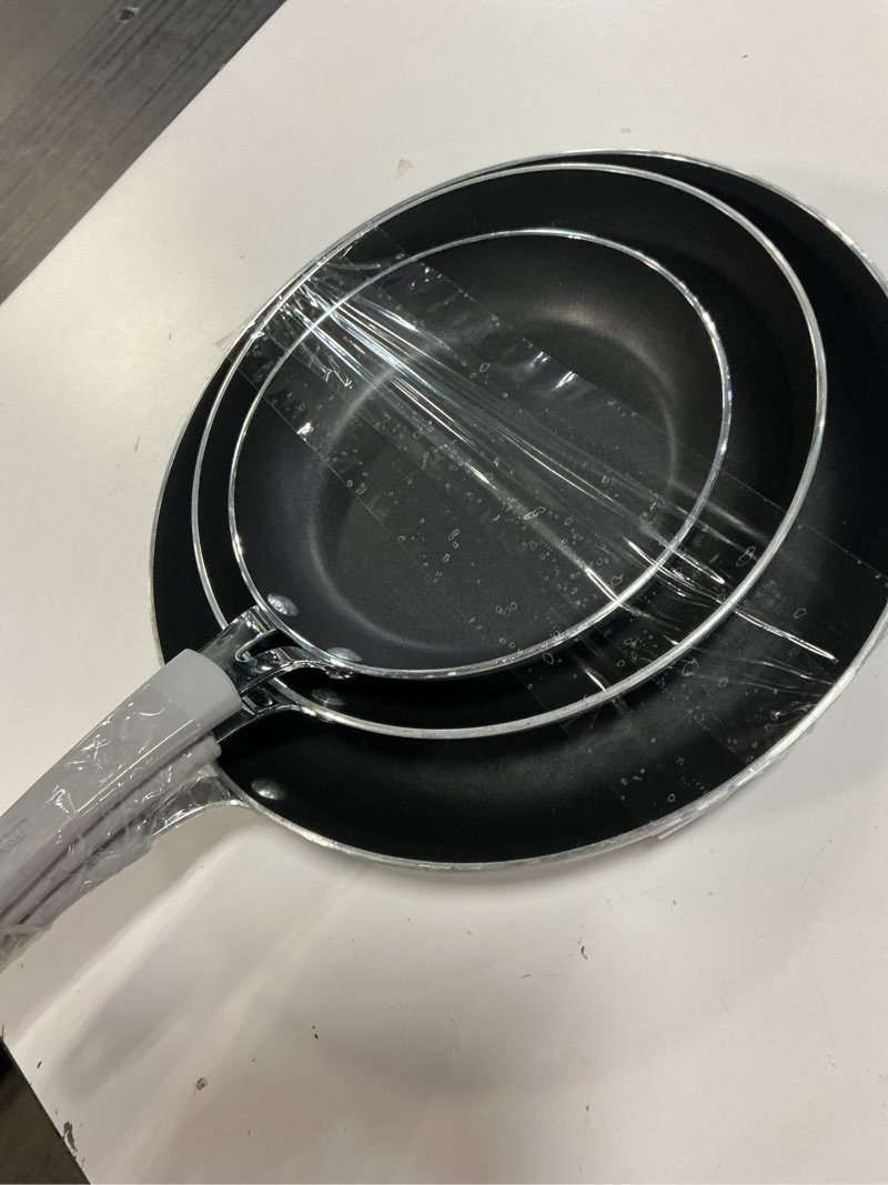 Condition photo showing As Is for tramontina 3 piece nonstick fry pan set 8" 10" 12", heavy-gauge aluminum, porcelain enamel exterior, reinforced nonstick interior is made without pfoa. riveted soft-grip silicone handle.