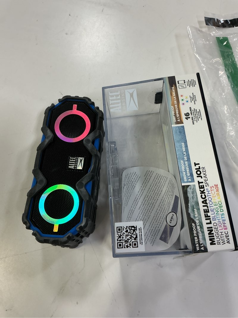 Condition photo showing item condition for Altec Lansing LifeJacket Mini - Waterproof Bluetooth Speaker with Lights, Portable Wireless Speaker for Pool, Beach, Hiking, Sports, Camping, 16 Hour Playtime, Floats in Water Royal Blue w/Lights Light Up