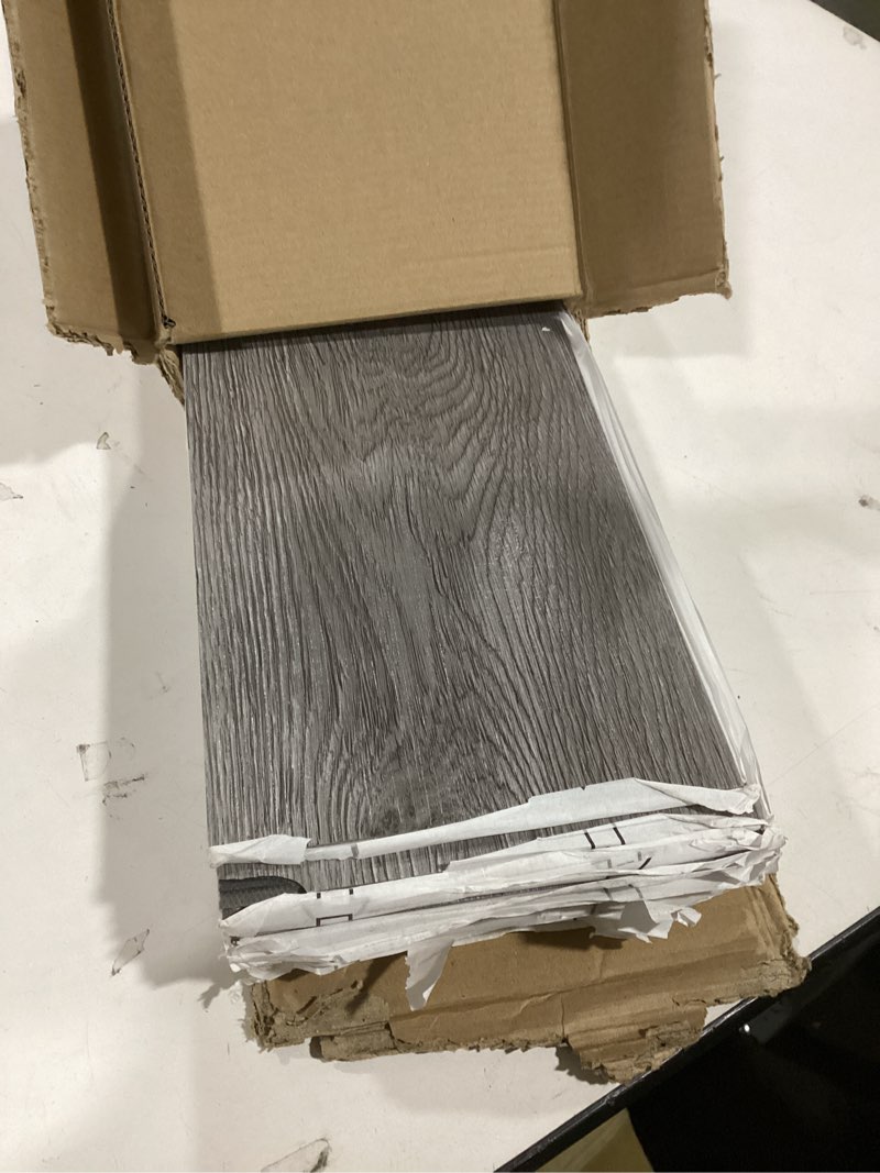 Condition photo showing Good Condition for Art3d Peel and Stick Floor Tile Vinyl Wood Plank 36-Pack 54 Sq.Ft, Deep Gray, Rigid Surface Hard Core Easy DIY Self-Adhesive Flooring 36 x 6 x 0.1 inches Deep Grey 36