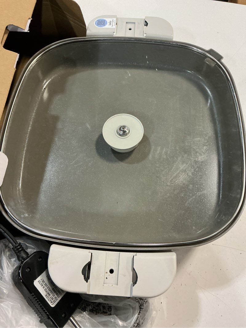 Condition photo showing As Is for bella make & take xl electric skillet, fits-anywhere™ kitchenware, evergood™ ceramic coating, adjustable temperature & dishwasher-safe tempered glass lid, cast aluminum base, 1200 watt, oatmilk