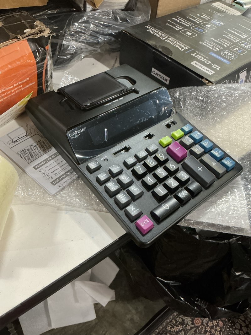 Condition photo showing New/Like New for catiga 12 digit thermal printing calculator with tape print out, ink-free adding machine, 5x faster quite at 8.0 lps, extra large fluorescent display, tax calculation with clock and calendar, sp-2401 thermal black