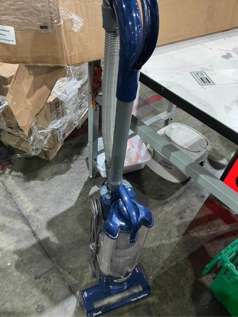 Condition photo showing As Is for used but has all pieces shark nv105 navigator light upright vacuum (blue)