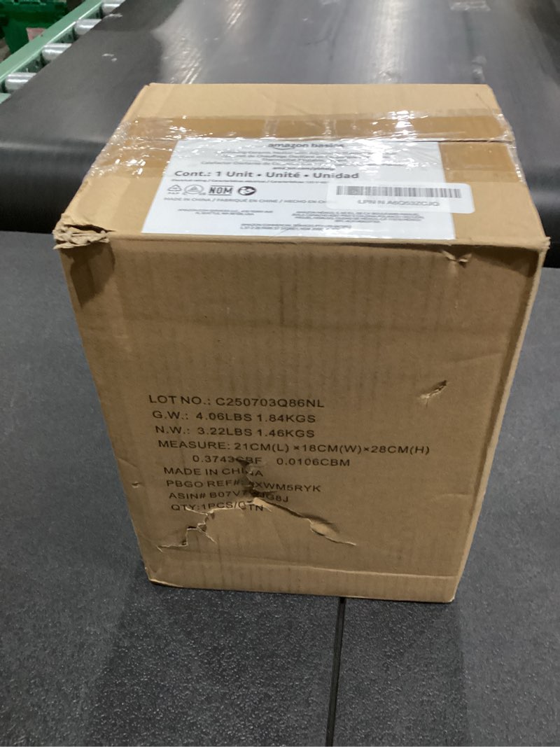 Condition photo showing As Is for Amazon Basics Oscillating Ceramic Space Heater, Portable Indoor Heating Solution, With Overheat and Tip-Over Protection, Thermostat, 1500W, 7.52"D x 6.34"W x 9.45"H, Silver Oscillating silver