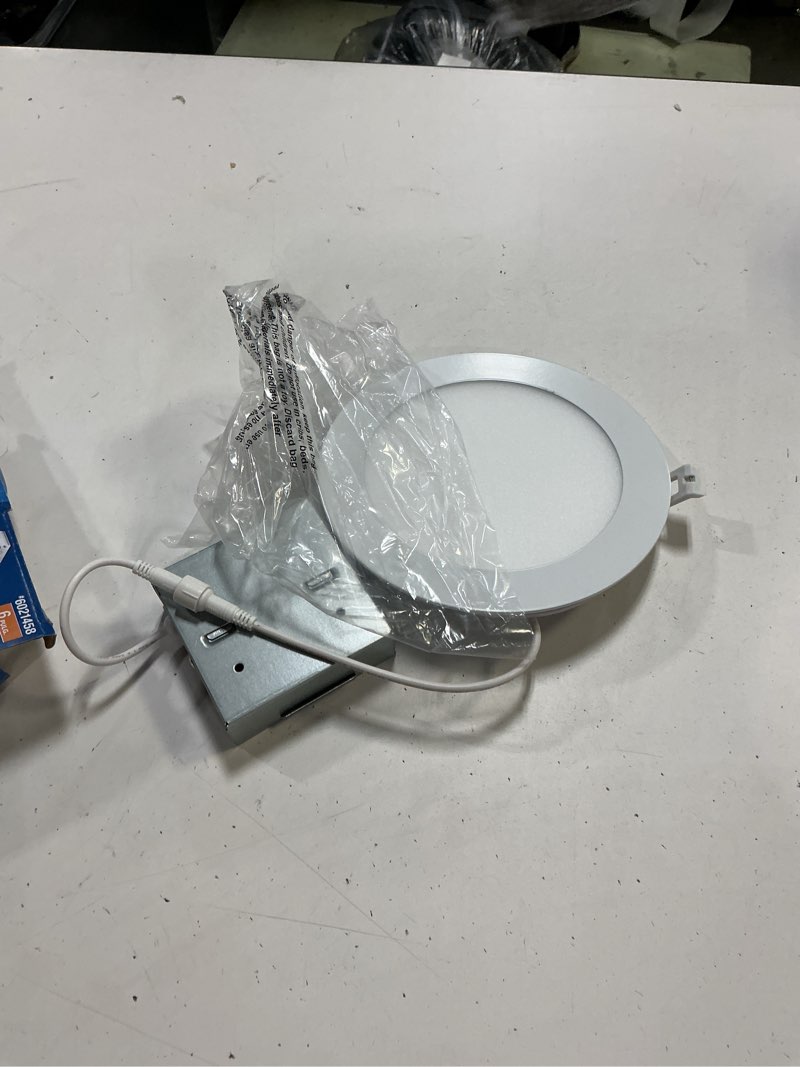 Condition photo showing As Is for utilitech white 6-in 850 -lumens switchable white round dimmable led canless wet rated recessed downlight