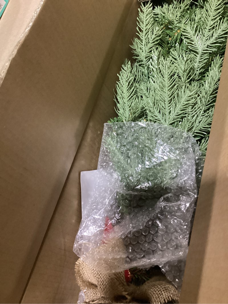 Condition photo showing As Is for national tree company 3 ft pre-lit nordic spruce mini artificial christmas tree, burlap base, red bow, 50 clear led lights, 363 tips, timer, green