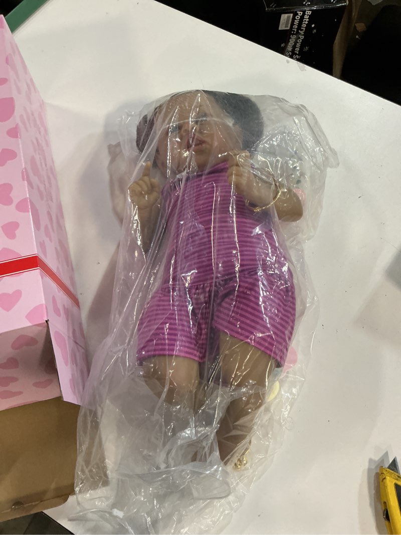 Condition photo showing item condition for Reborn Baby Dolls Black Girl, 22" Realistic Baby Doll Lifelike African American Newborn Bebe Caramel Real Life Like Baby Dolls with Two Afro Puffs & Feeding Toys in Gift Box for Kids Age 3+