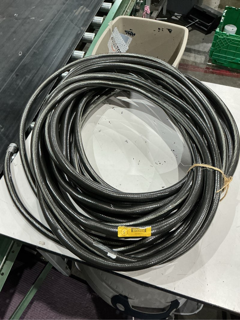 Condition photo showing As Is for unknown size. neverkink max teknor apex contractor -duty kink free vinyl black coiled hose