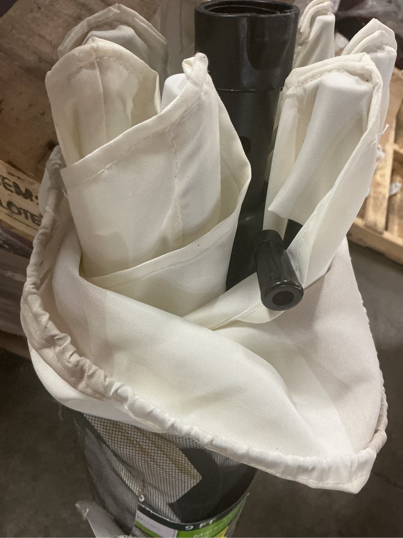 Condition photo showing As Is for 9 ft. round 8-rib steel market patio umbrella in beige and white stripe