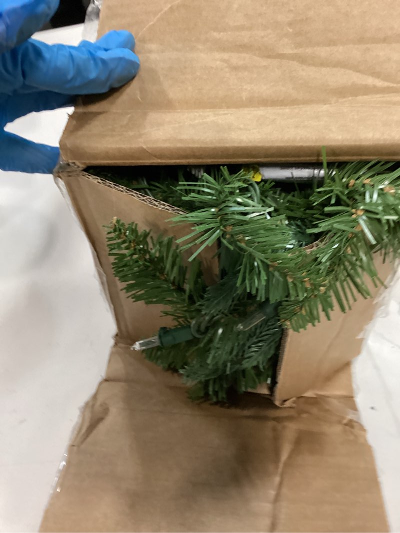 Condition photo showing As Is for National Tree Company Pre-Lit 'Feel Real' Artificial Christmas Garland, Green, Frasier Grande, White Lights, Plug In, Christmas Collection, 9 Feet