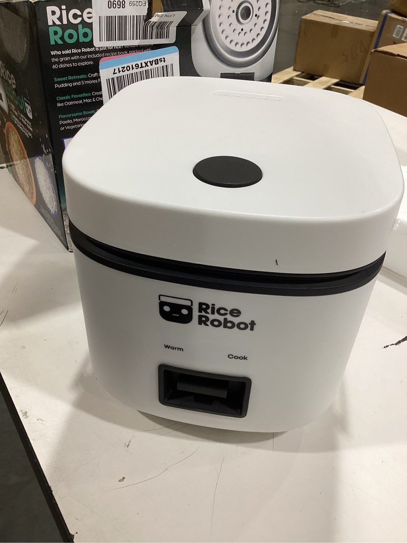 Condition photo showing As Is for rice robot personal rice cooker, pfas-free, nonstick. 1 quart capacity, with stainless steel steamer tray, measuring cups, recipe book with 60 recipes, and serving spoon, as seen on tv 2-cup (uncooked) | 4-cup cooked