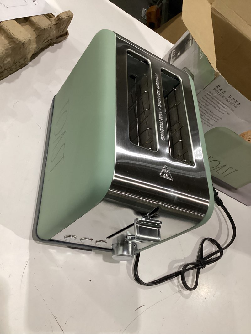 Condition photo showing New/Like New for rae dunn toaster, stainless steel 2 slice square toaster, wide slot with 5 browning levels, with bagel, defrost and cancel options (sage)