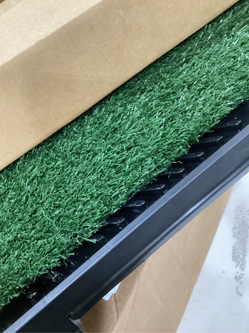 Condition photo showing As Is for DUMOS Dog Grass Pad with Tray, 25" x 20" Grass Pad for Dogs Potty, Reusable Artificial Grass Pee Pad for Indoor & Outdoor Use, Easy Clean with Drainage Holes, for Puppy Potty Training Green&black 25"L x 20"W