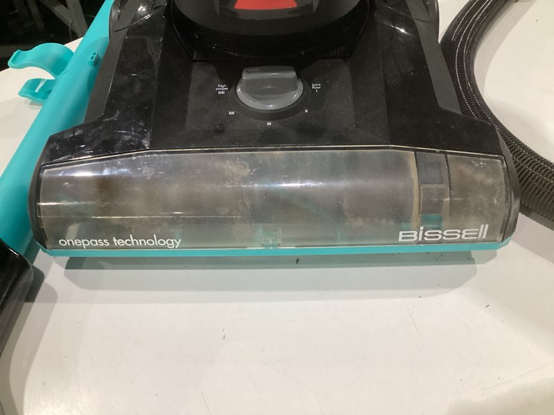 Condition photo showing As Is for (used, not tested)bissell cleanview rewind upright bagless vacuum with automatic cord rewind & active wand, 3534 black/teal