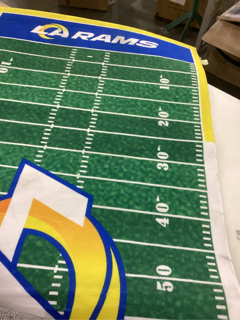 This is a Los Angeles Rams football field mat or rug.  