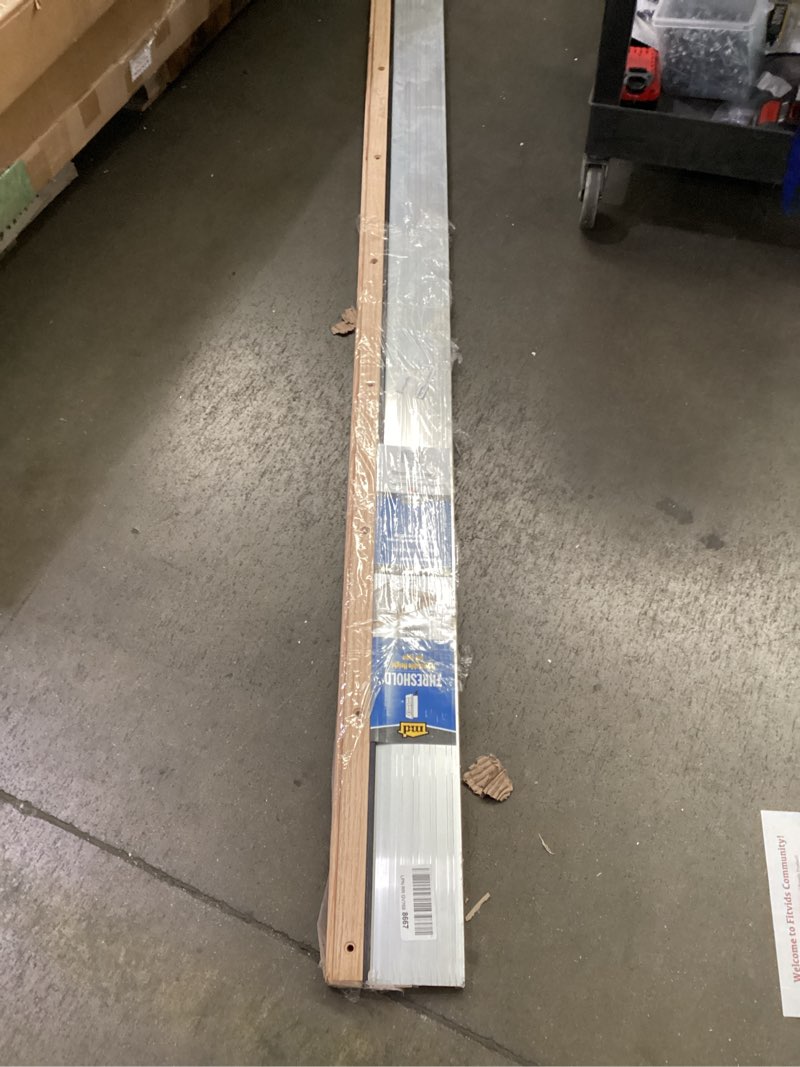 Condition photo showing Good Condition for m-d building products 78618 5-5/8 in. x 1-1/8 in. x 73 in. silver adjustable aluminum & hardwood threshold kit - versatile solution for french and exterior doors silver "5 5/8 in x 73 in"