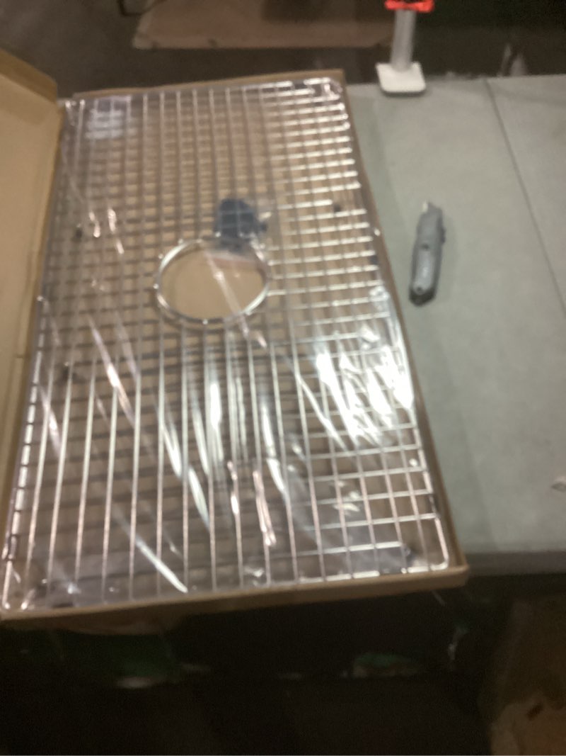 Condition photo showing Good Condition for serene valley sink bottom grid 28-9/16" x 15-9/16", centered drain with corner radius 3/8", sink protector ndg2916c